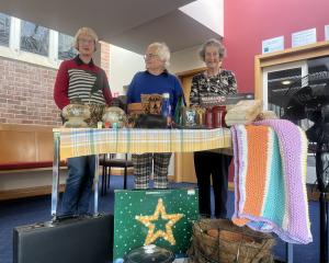 Showing off a mock stall of what to expect at this weekend’s St Andrew’s Fair are organisers Jan...