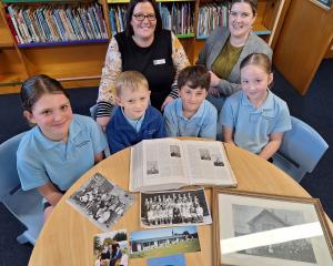 Excited to show their photo archives for the Wallacetown School 160 jubilee are principal Lisa...