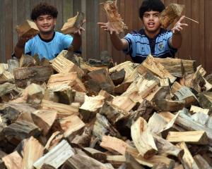 King’s High School students Siaki Ramsay (left), 16, and Nantei Teweti, 15, about to stack a pile...