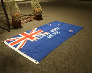 An artwork of a flag stencilled with the words “Please Walk On Me” has angered the local RSA who...