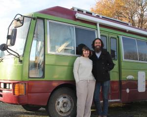 Tussock Country volunteers Sally Laws and Kevin Jackson with their Nissan Civilian house bus, at...