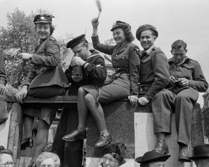 A celebration like no other ... Members of the British Armed Forces among the crowds celebrating...