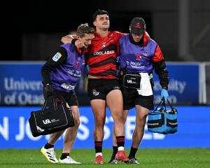 Taha Kemara leaves the field after sustaining an injury during the round 11 Super Rugby Pacific...
