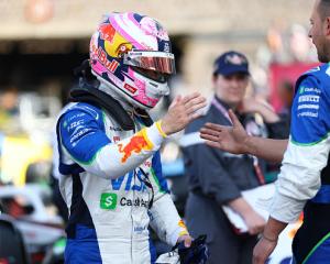 Liam Lawson celebrates with his teammates after a strong showing for RB Racing in Monaco. Photo:...