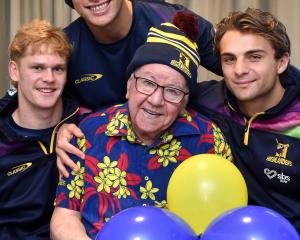 Highlanders (from left) Finn Hurley, Thomas Umaga-Jensen and James Arscott visit superfan Dennis...