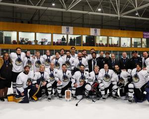 The Ice Blacks celebrate their bronze medal in the division 2, group B world championships in...
