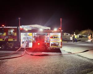 Firefighters at the scene in Cromwell. Photo: Kim Bowden