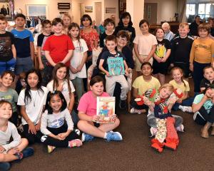 New Zealand children's author Joy Cowley, 88, with pupils from Halfway Bush School and her new...