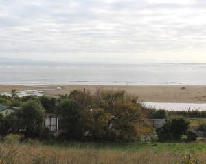 Omaui is a coastal settlement south of Invercargill with views of a beach and estuary. Photo:...