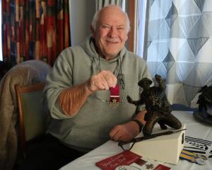 New Zealand Remembrance Army Waitaki regional co-ordinator Barry Gamble shows the miniature...