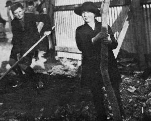 Master and Miss Ross, children of the chairman of the Exhibition company, plant the first tree...