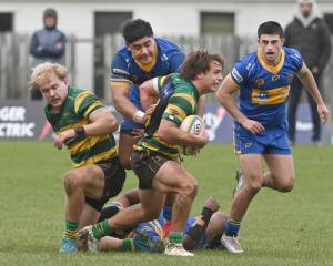 Green Island halfback James Arscott attempts to clear the ruck during a Dunedin division 1 game...
