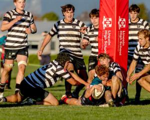 Selwyn Schools first-five Ryder Allin forces his way over the line for the winning try. PHOTO:...