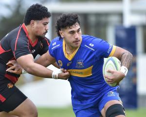 Taieri lock Eric Peita tries to get past Zingari-Richmond prop Vika Tofa at Montecillo on...