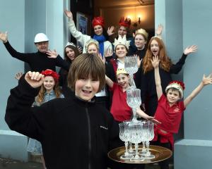 Ruben Escott, 10, of Dunedin, leads celebrations at the Playhouse Theatre over funding for...