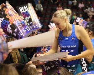 Carys Stythe signs autographs for Southern Steel fans in Invercargill last weekend. PHOTO:...