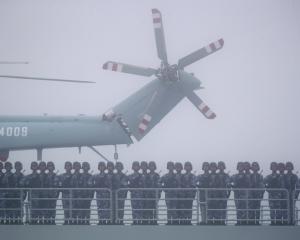 Chinese soldiers during a naval parade. PHOTO: AP
