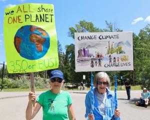 Climate protesters outside the G7 meeting in Canada. PHOTO: REUTERS
