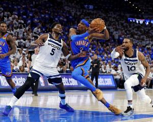 Oklahoma City Thunder guard Shai Gilgeous-Alexander drives to the basket against the Minnesota...