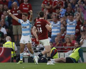 Argentina's Santiago Cordero celebrates scoring a try against the Lions. Photo: Reuters
