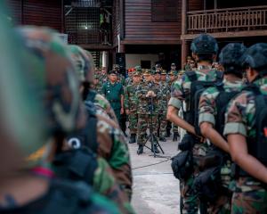 Cambodia's Prime Minister Hun Manet speaks during a visit to a military base, following a clash...