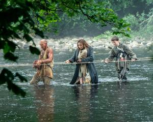 From left, Ralph Fiennes, Jodie Comer and Alfie Williams in 28 Years Later. PHOTOS: SONY PICTURES...