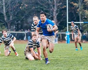 Southland Boys’ winger Zeke Siola charges to one of his three tries during the interschool...