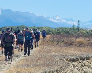 Goldfields Cavalcade hikers make their way towards Twizel on the Moira’s Meander Trail in...