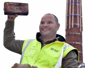 Project manager Paul Stevenson with a couple of the 4000 bricks rescued from the chimney of the...