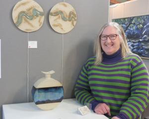 Alexandra-based ceramicist Ruth Arnott poses with some of her work on display and sale at the...