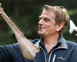 University of Otago visiting academic Dr Daniel Thomas, of Auckland, holds a 3-Dprinted ancient...