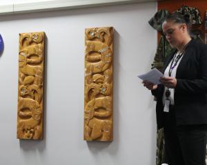 Work broker Aroha Sell speaks at the unveiling of two reinstalled taonga whakairo (carvings) at...