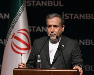 Iranian Foreign Minister Abbas Araghchi delivers a speech during a press conference as he attends...