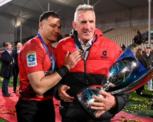 David Havili of the Crusaders and head coach Rob Penney celebrate after winning the Super Rugby...