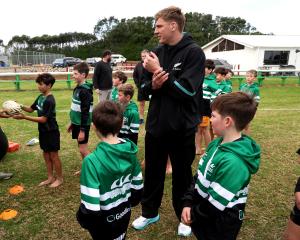Fabian Holland runs a skills session with youngsters at the Coastal Rugby Club, in Taranaki,...