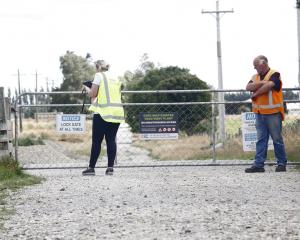 WorkSafe New Zealand officials examine the the gate through which Lachie Jones is thought to have...