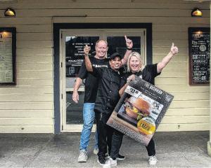 JJ Sandall, Mel Elliot, and head chef Yash Rawat celebrate their Bushman burger being selected as...