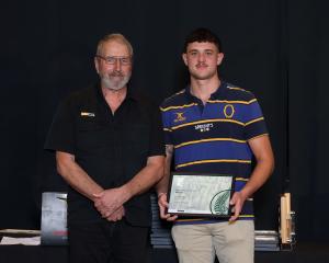 Callum Maze, of Roxburgh Logging (right), with John Taal from the Milton Stihl Shop, receives the...