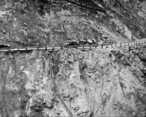 An awkward moment on the Kawarau Gorge road between Arrowtown and Gibbston (future SH6) as cars...