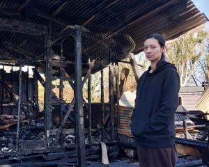 Heeni Millar stands inside the remains of her family home, which burned down last Thursday. PHOTO...