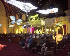 First Church transformed into the "fluttering meadows" as visitors watch a performance.