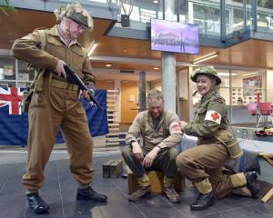 Lee George Russell guards a captive, Hamish Norton, while Rolien Ham-Geliefde provides treatment...