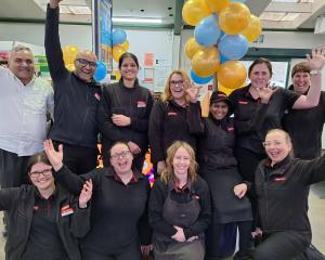 Plaza SuperValue Invercargill owners Jigs and Shelly Buha (back row, second and third from left)...
