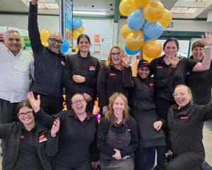 Plaza SuperValue Invercargill owners Jigs and Shelly Buha (back row, second and third from left)...