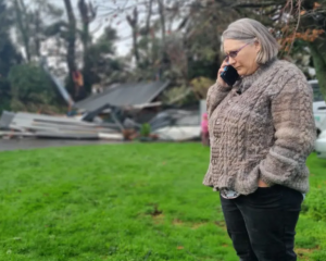 Shirlene Patterson's 100-year-old villa in Tuiti St had much of its roof ripped off. Photo: RNZ 