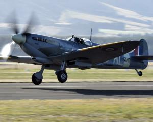 A vintage Spitfire takes off for a practice flight during Warbirds over Wanaka last year. PHOTO:...
