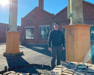 Dunedin Gasworks Museum Trust chairman Jonathan Cweorth stands in front of the now truncated and...