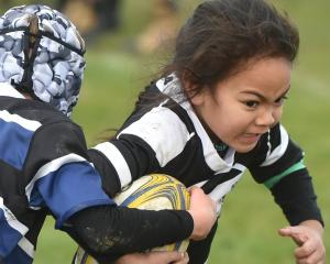 Southern player Utalia Moataane, 6, charges on at the annual Taieri sevens junior rugby...