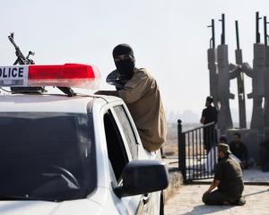 A Bedouin fighter at an Internal Security Forces checkpoint on Saturday. Photo: Reuters 