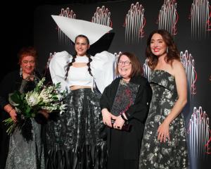 Annalisa Wikitoria McConachie (second left) wears the 2025 MLT Hokonui Fashion Design Awards ‘...